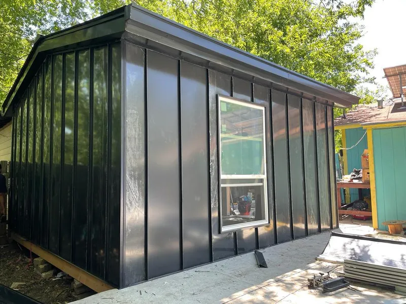 Black standing seam metal wall panels for Metal Roof Installation in Mattapoisett