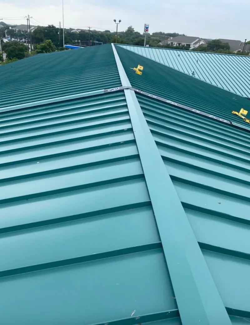 Green commercial metal roof ridge and valley for Metal Roof Repair in Mattapoisett